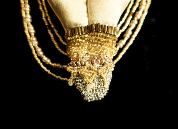 Beaded Doll with Gold Colored Beads