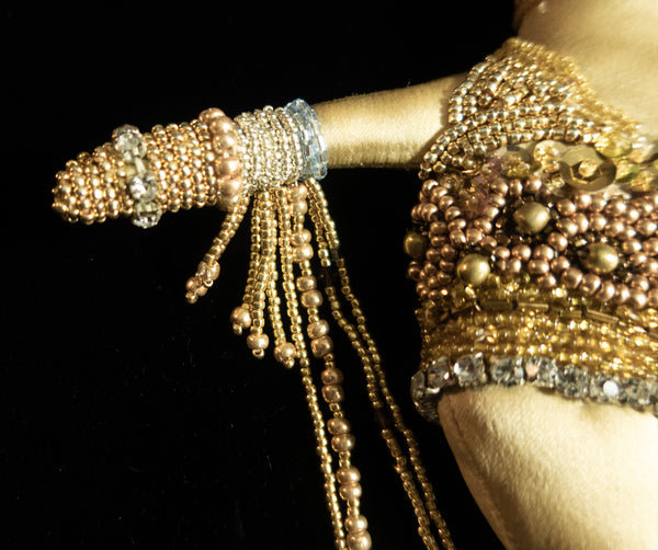 Beaded Doll with Gold Colored Beads