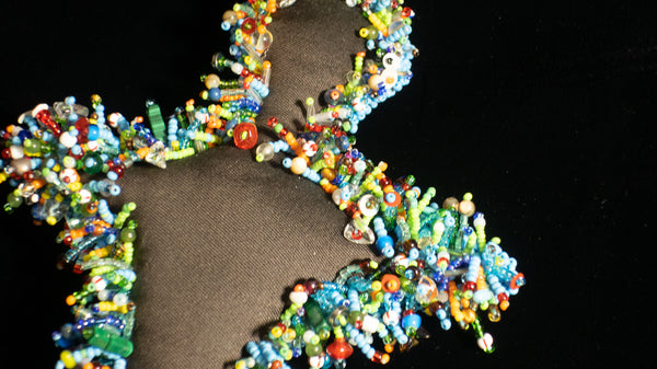 Beaded Doll with Turquoise Colored Glass Beads