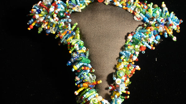 Beaded Doll with Turquoise Colored Glass Beads