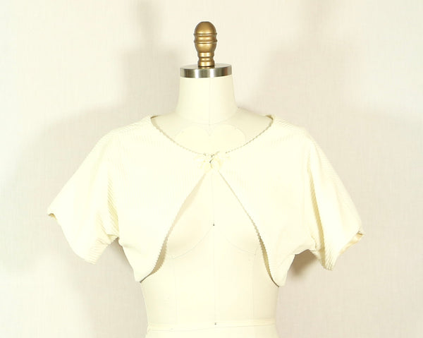 White Corduroy Shrug with Mother of Pearl Detail